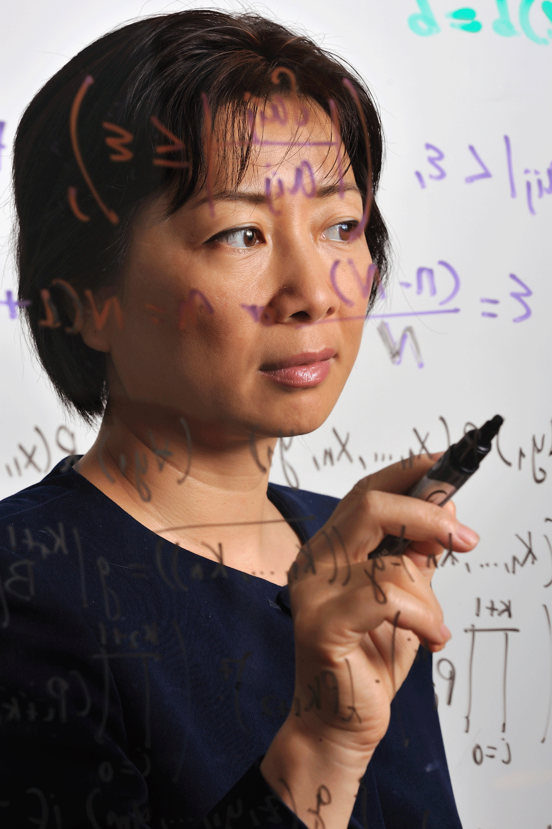 Photograph of female mathematician and equations