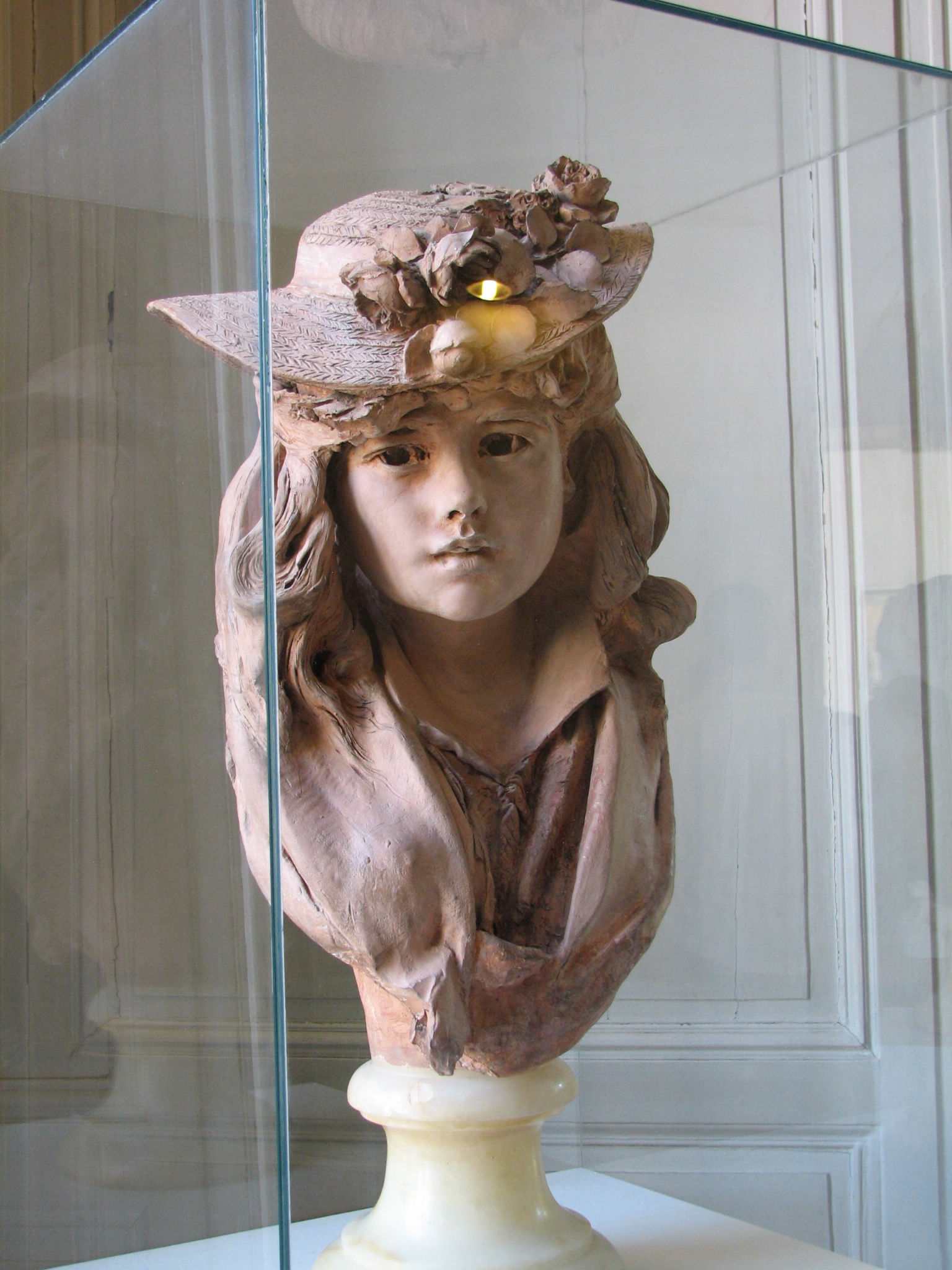 Rodin's girl with a flower hat
