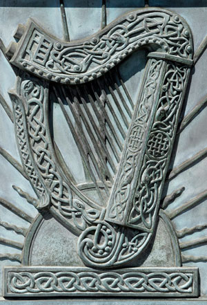 Photo of old Irish harp carved in stone