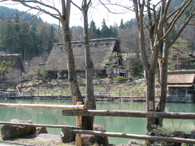 A typical house with a steep thatched roof.